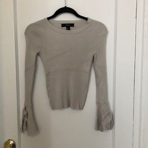 Fitted sweater with flare sleeves